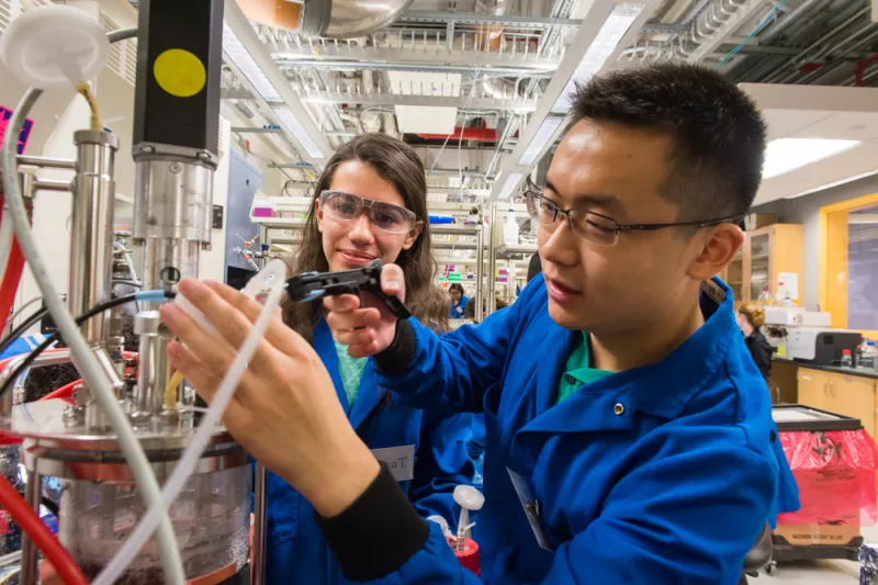 Two students work together in Chemical-Biological Engineering Laboratory