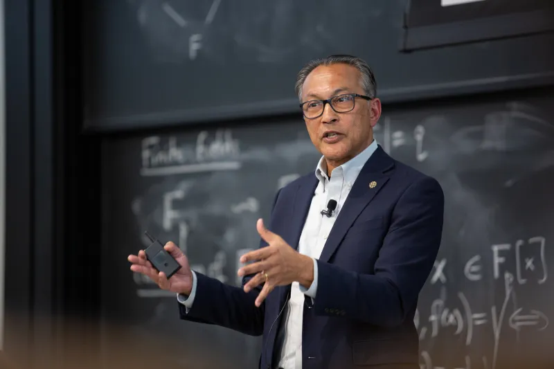 World Resources Institute President and CEO Ani Dasgupta speaks in front of a chalkboard at MITEI's Earth Day Colloquium.