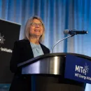 A woman speaks at the podium at MITEI’s 2024 Annual Research Conference.