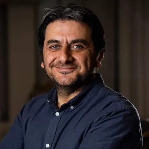 Headshot of Cemal Tasan