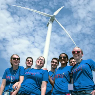First-year Preorientation Program students with a wind turbine.