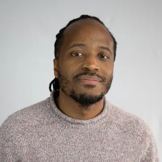 A headshot of Dominic-Mathurin