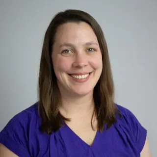 A headshot of Kelly McGinity